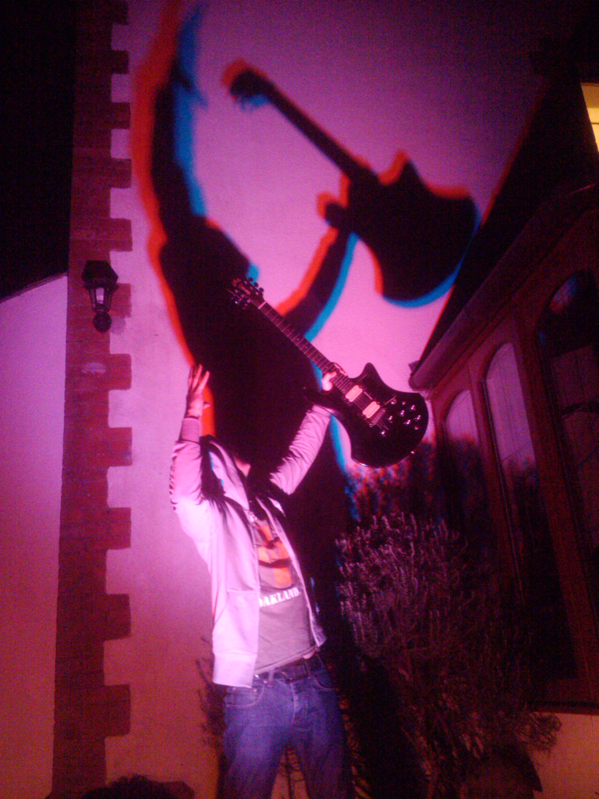 Guitar silhouette at a live Wasteland show